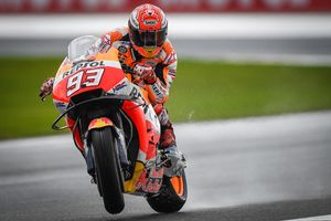 Marquez tops Miller on wet opening day at Valencia